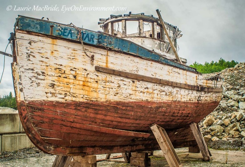Old wooden fishboat on dry land
